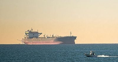 Tanker hit by unknown projectile near Oman, raising Strait of Hormuz security risks