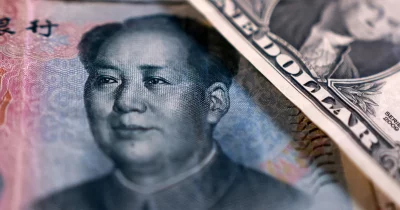 China banks raise dollar deposit rates to curb yuan appreciation
