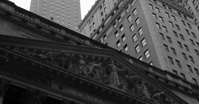 Dow hits record close as NASDAQ and S&P 500 slip on tech rotation