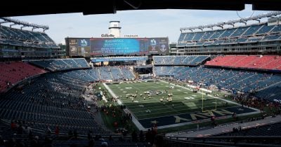 Gillette Stadium covers sponsor names on every seat for FIFA compliance