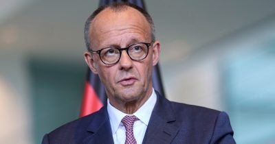 German Chancellor calls for dialogue with China over yuan manipulation concerns