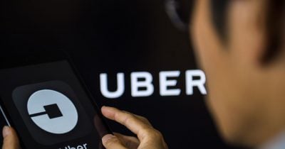Uber profit narrowly beats forecasts as trips surge, but Wall Street isn’t celebrating