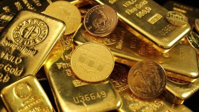 Gold hits three-week low as stronger dollar, inflation fears weigh